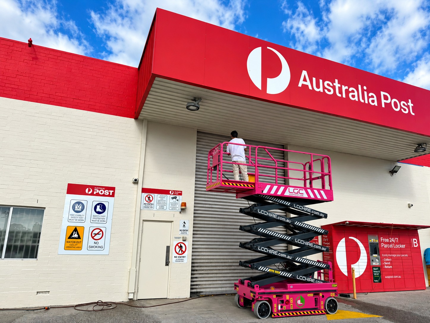 Commercial painting for businesses in Perth - Australia Post facility with scissor lift