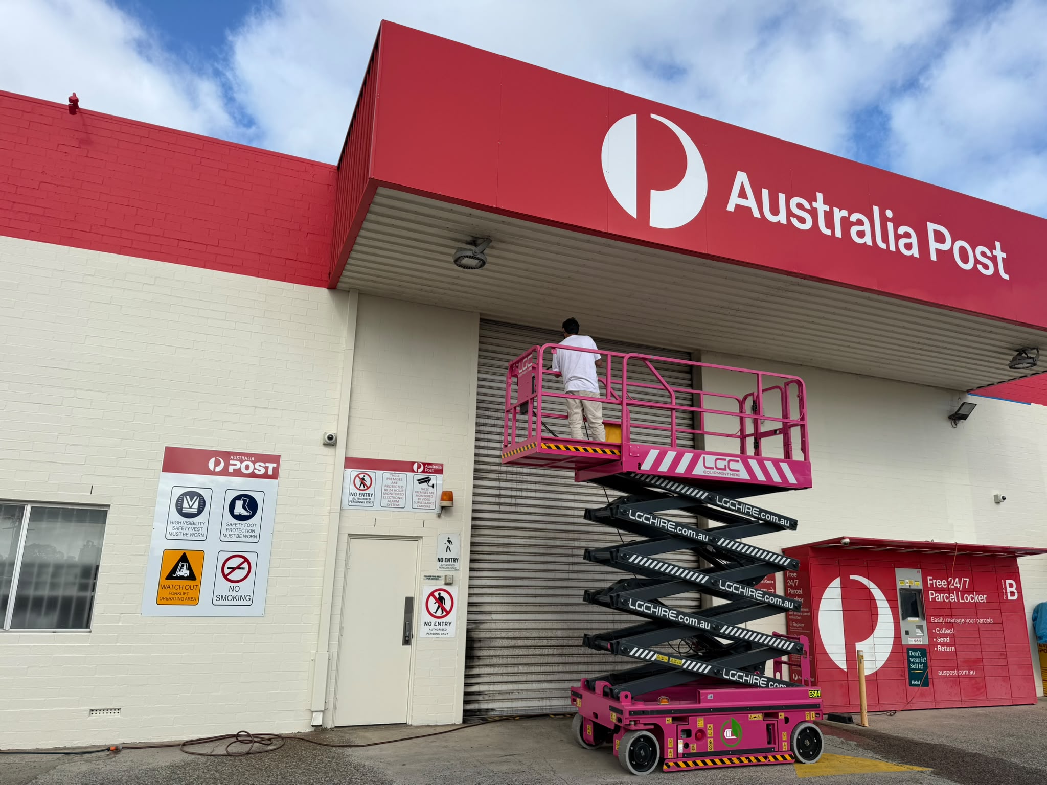 Australia Post commercial facility exterior repaint with scissor lift