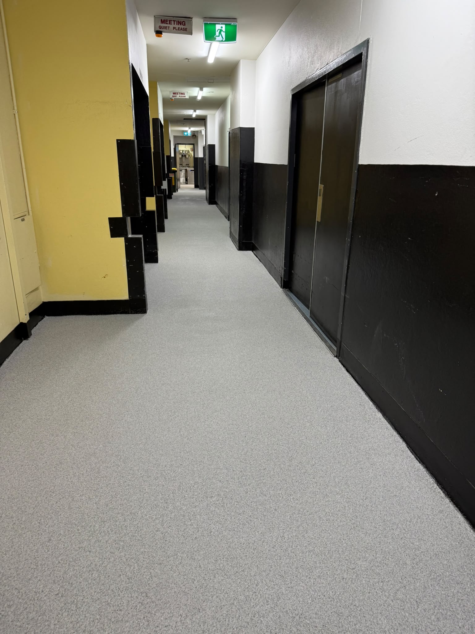 Seamless non-slip commercial epoxy flake flooring in Perth corridor