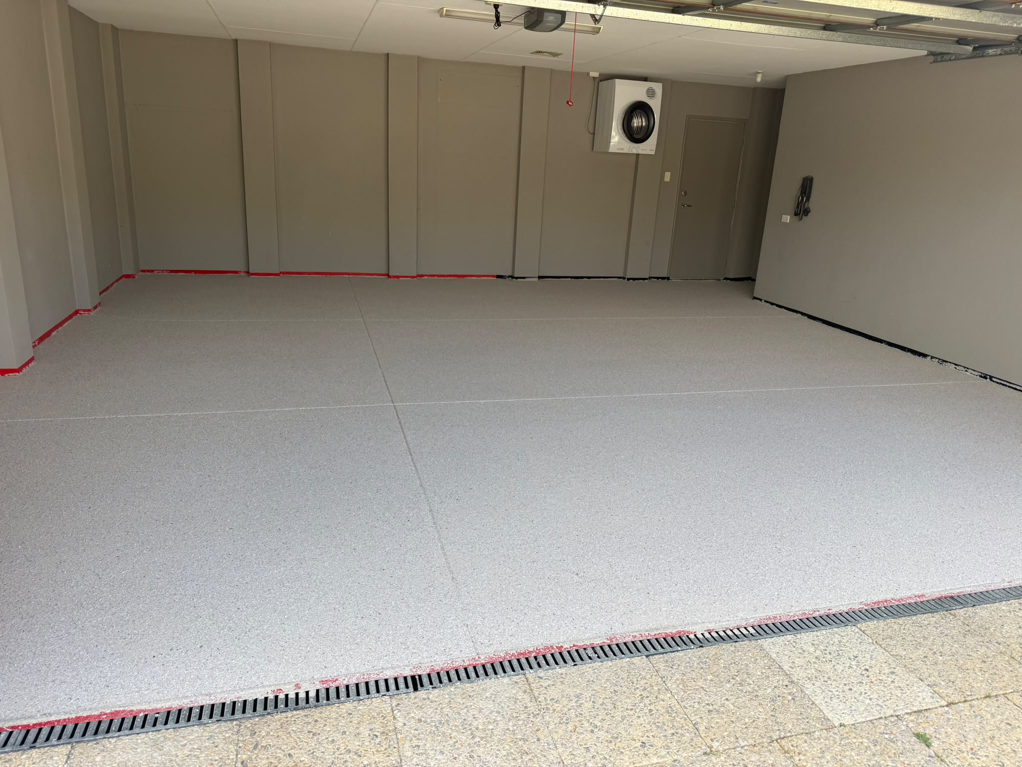 Seamless grey double garage epoxy flake floor coating in Perth home