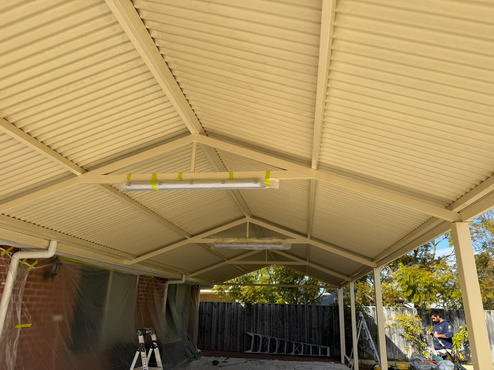 Metal pitched pergola and patio roof spray painting for Perth residential home