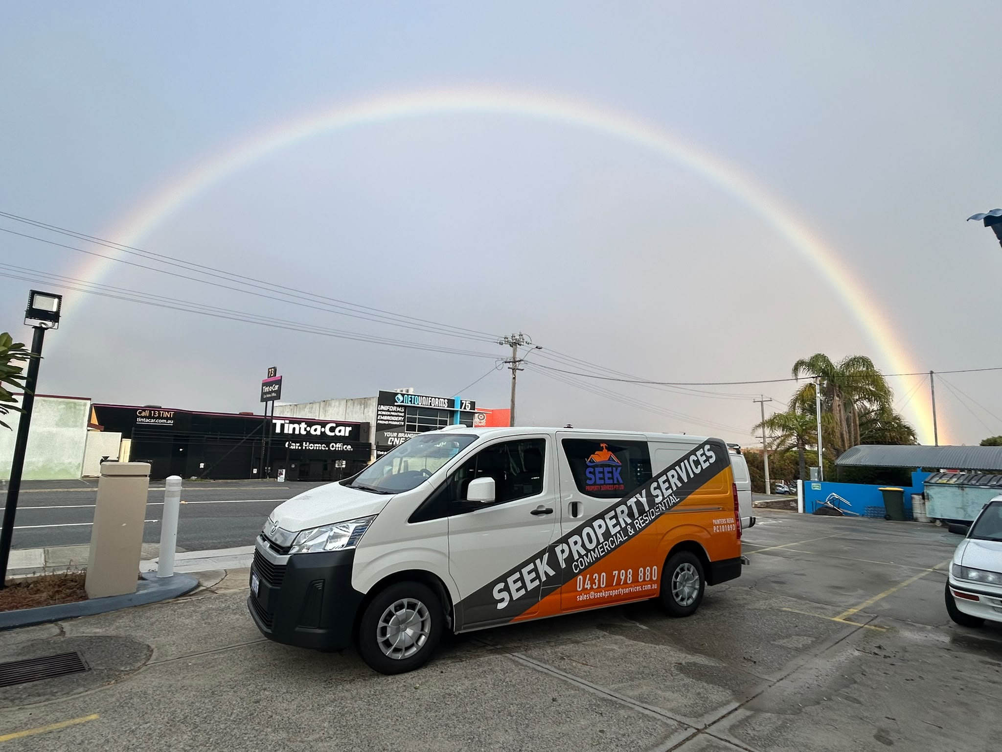 SEEK Property Services mobile trade fleet van under rainbow in Perth WA